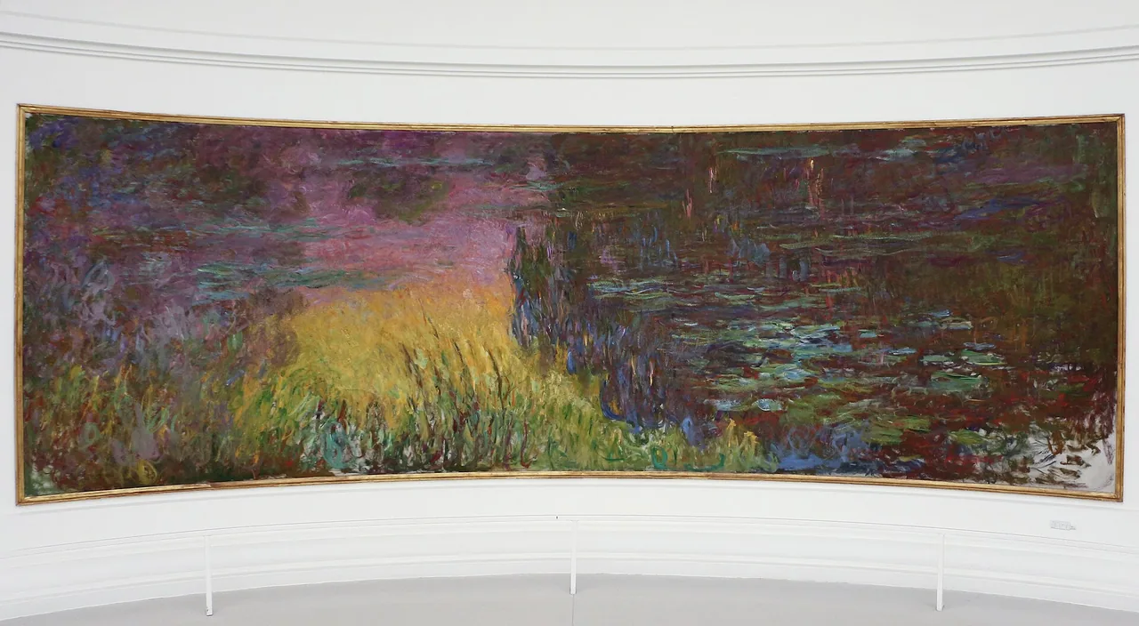 A wide, gently curved painting in a gilt frame on a white wall: a pond with water lilies, on the left a glowing yellow bank of reeds and purple-pink reflections of the sky.